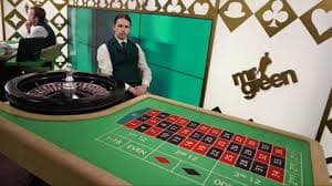 mami188 login app layout showing Over Under betting slip and live match score with roulette table in background tab